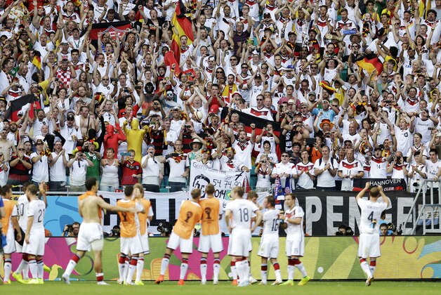 German fans cheer the German team after their 4-0 victory over Portugal during the group G World Cup soccer match between Germany and Portugal at the Arena Fonte Nova in Salvador, Brazil, Monday, June 16, 2014.  (AP Photo/Natacha Pisarenko)