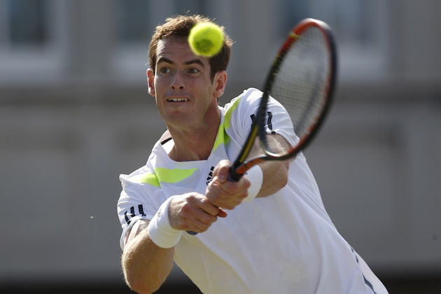 Andy Murray of Britain plays a return to Radek Stepanek of Czech Republic during their Queen's Club grass court championships 3rd round tennis match in London, Thursday, June 12, 2014. (AP Photo/Sang Tan)