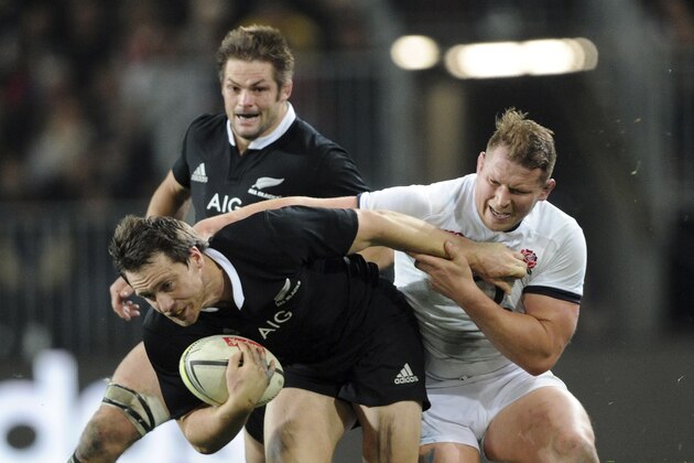 New Zealand’s Ben Smith, front, tackled by England’s Dylan Hartley in the second international rugby test match at Forsyth Barr Stadium in Dunedin, New Zealand, Saturday, June 14, 2014. (AP Photo/SNPA, Ross Setford) NEW ZEALAND OUT