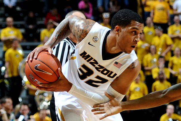 Nov 12, 2013; Columbia, MO, USA; Southern Illinois Salukis guard Mike Balogun (0)  tries to steal the ball from Missouri Tigers guard Jabari Brown (32) during the first half at Mizzou Arena. Mandatory Credit: Dak Dillon-USA TODAY Sports