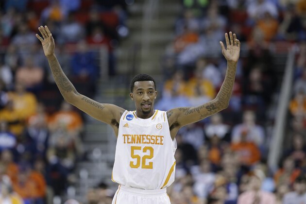 Tennessee guard Jordan McRae (52) celebrates near  the end of the second half of an NCAA college basketball third-round tournament game against Mercer, Sunday, March 23, 2014, in Raleigh. Tennessee Won 83-63. (AP Photo/Gerry Broome)