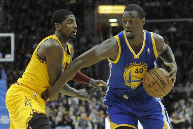 Dec 29, 2013; Cleveland, OH, USA; Golden State Warriors small forward Harrison Barnes (40) dribbles the ball around Cleveland Cavaliers point guard Kyrie Irving (2) in the second quarter at Quicken Loans Arena. Mandatory Credit: David Richard-USA TODAY Sports