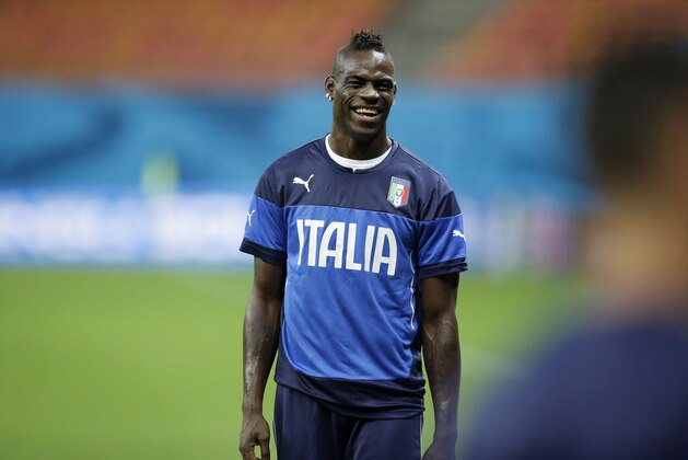 Italy's Mario Balotelli takes part in a training session of the Italy national soccer team at the Arena da Amazonia in Manaus, Brazil, Friday, June 13, 2014.  England play Italy in group D of the 2014 soccer World Cup at the stadium on Saturday. (AP Photo/Matt Dunham)