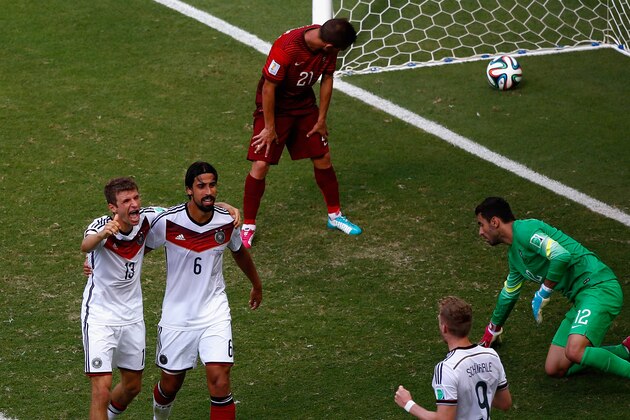 SALVADOR, BRAZIL - JUNE 16:  Thomas Mueller of Germany (L) celebrates scoring his team's fourth goal and completing his hat trick with Sami Khedira and Andre Schuerrle as Joao Pereira and goalkeeper Rui Patricio of Portugal look on during the 2014 FIFA World Cup Brazil Group G match between Germany and Portugal at Arena Fonte Nova on June 16, 2014 in Salvador, Brazil.  (Photo by Matthew Lewis/Getty Images)