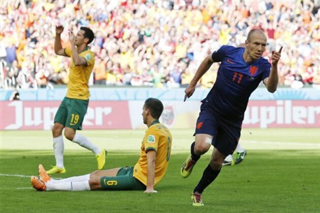 Netherlands' Arjen Robben (11) celebrates after scoring his side's first goal during the group B World Cup soccer match between Australia and the Netherlands at the Estadio Beira-Rio in Porto Alegre, Brazil, Wednesday, June 18, 2014. (AP Photo/Jon Super)
