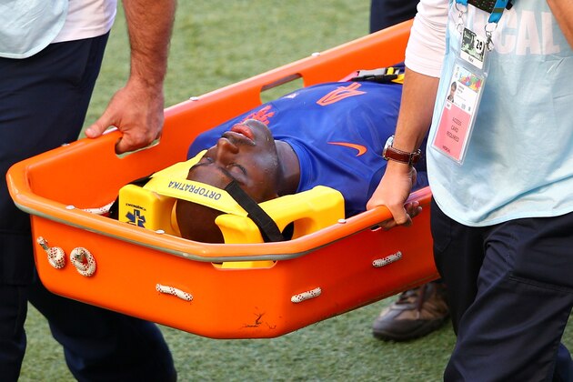 PORTO ALEGRE, BRAZIL - JUNE 18:  Bruno Martins Indi of the Netherlands is stretchered off the field during the 2014 FIFA World Cup Brazil Group B match between Australia and Netherlands at Estadio Beira-Rio on June 18, 2014 in Porto Alegre, Brazil.  (Photo by Paul Gilham/Getty Images)