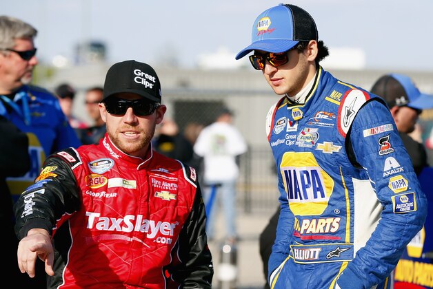 NEWTON, IA - MAY 17:  Regan Smith (L), driver of the #7 TaxSlayer.com/Great Clips Chevrolet, talks with Chase Elliott, driver of the #9 NAPA Auto Parts Chevrolet, before qualifying for the NASCAR Nationwide Series Get To Know Newton 250 Presented By Sherwin Williams at Iowa Speedway on May 17, 2014 in Newton, Iowa.  (Photo by Matt Sullivan/Getty Images)