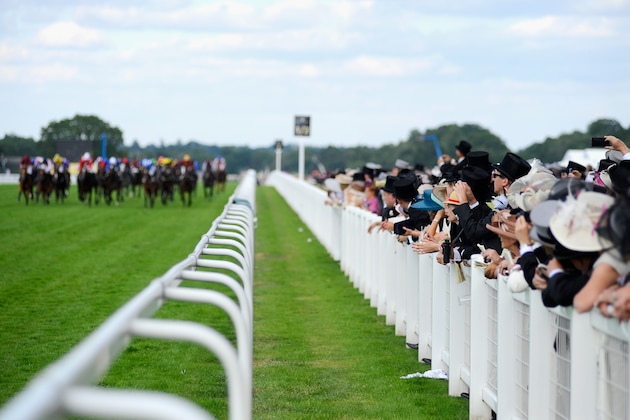 ASCOT, ENGLAND - JUNE 18:  A general view of race goers as they watch the Sandringham Handicap Stakes during day two of Royal Ascot at Ascot Racecourse on June 18, 2014 in Ascot, England.  (Photo by Alan Crowhurst/Getty Images for Ascot Racecourse)
