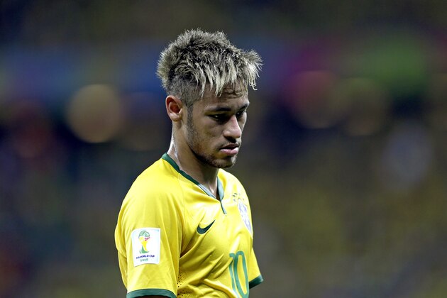 Brazil's Neymar looks down during the group A World Cup soccer match between Brazil and Mexico at the Arena Castelao in Fortaleza, Brazil, Tuesday, June 17, 2014. (AP Photo/Andre Penner)