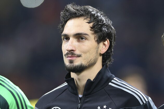 Germany defender Mats Hummels stands prior to the start of a friendly soccer match between Italy and Germany at the San Siro  stadium in Milan, Italy, Friday, Nov. 15, 2013. (AP Photo/Antonio Calanni)