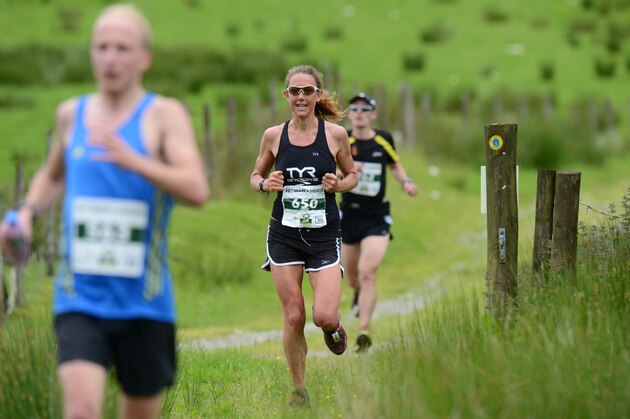 LLANWRTYD WELLS, WALES - JUNE 14:  In this handout image provided by Whole Earth Peanut Butter, runners compete in the Man v Horse  Marathon powered by Whole Earth Peanut Butter on June 14, 2014 in Llanwrtyd Wells, Wales. The annual race, which started in 1982 sees runners compete against riders on horse-back over 24 miles of challenging terrain.  (Photo by Whole Earth Peanut Butter via Getty Images)