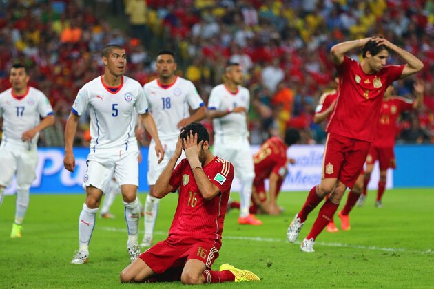 RIO DE JANEIRO, BRAZIL - JUNE 18:  Sergio Busquets of Spain reacts after a missed chance during the 2014 FIFA World Cup Brazil Group B match between Spain and Chile at Maracana on June 18, 2014 in Rio de Janeiro, Brazil.  (Photo by Jamie Squire/Getty Images)