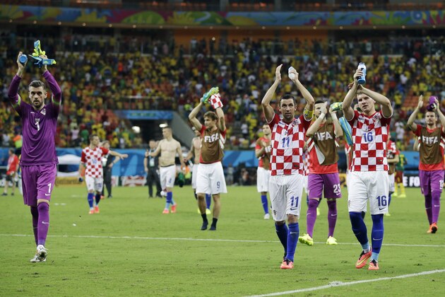 Croatian players applaud their supporters following their 4-0 victory over Cameroon during the group A World Cup soccer match between Cameroon and Croatia at the Arena da Amazonia in Manaus, Brazil, Wednesday, June 18, 2014.  (AP Photo/Martin Mejia)