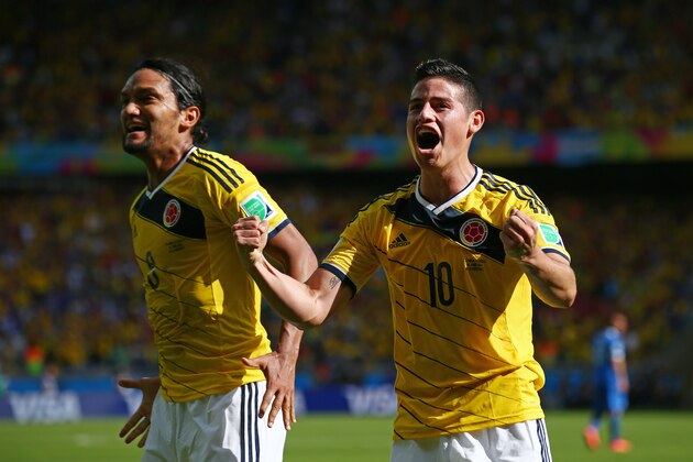 BELO HORIZONTE, BRAZIL - JUNE 14:  Abel Aguilar and James Rodriguez of Colombia celebrate the second goal during the 2014 FIFA World Cup Brazil Group C match between Colombia and Greece at Estadio Mineirao on June 14, 2014 in Belo Horizonte, Brazil.  (Photo by Ian Walton/Getty Images)