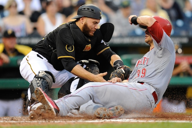 PITTSBURGH, PA - JUNE 18:  Devin Mesoraco #39 of the Cincinnati Reds slides safely into home plate in front of Russell Martin #55 of the Pittsburgh Pirates during the third inning on June 18, 2014 at PNC Park in Pittsburgh, Pennsylvania.  (Photo by Joe Sargent/Getty Images)