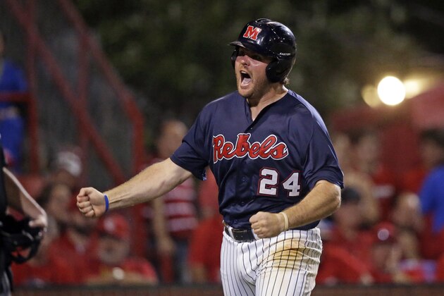 Mississippi infielder Sikes Orvis (24) reacts after scoring one of three runs on a fielding error in the ninth inning of an NCAA college baseball tournament super regional game in Lafayette, La.,Monday, June 9, 2014. Mississippi won 10-4 to advance to the College World Series. (AP Photo/Gerald Herbert)