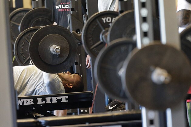 Atlanta Falcons linebacker Robert James lifts weights at their NFL football training complex, Tuesday, April 23, 2013, in Flowery Branch, Ga. (AP Photo/John Bazemore)