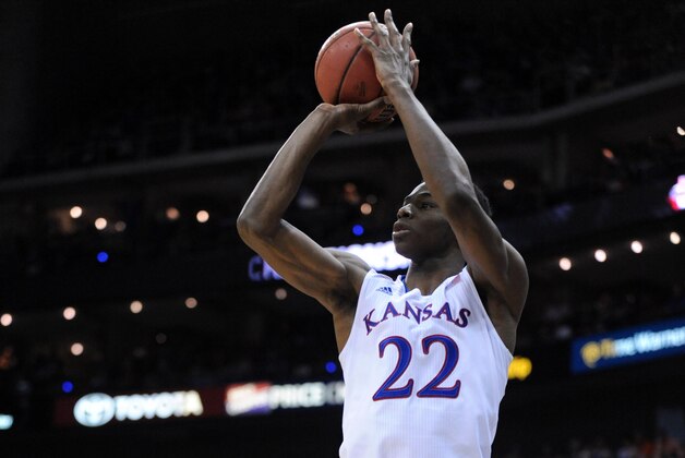 eMar 13, 2014; Kansas City, MO, USA; Kansas Jayhawks guard Andrew Wiggins (22) shoots a jumpshot during the second half against the Oklahoma State Cowboys in the second round of the Big 12 Conference college basketball tournament at Sprint Center. Kansas won 77-70 in overtime. Mandatory Credit: Denny Medley-USA TODAY Sports