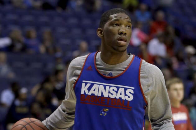 Kansas center Joel Embiid dribbles during practice for the NCAA college basketball tournament Thursday, March 20, 2014, in St. Louis. Kansas is scheduled to play Eastern Kentucky in a second-round game on Friday. (AP Photo/Jeff Roberson)