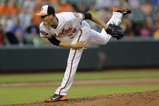 Baltimore Orioles starting pitcher Kevin Gausman follows through on a pitch to the Toronto Blue Jays during a baseball game, Thursday, June 12, 2014, in Baltimore. (AP Photo/Patrick Semansky)