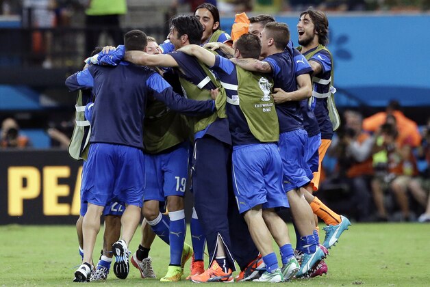 Italian players celebrate after the group D World Cup soccer match between England and Italy at the Arena da Amazonia in Manaus, Brazil, Saturday, June 14, 2014. Italy won the match 2-1.   (AP Photo/Matt Dunham)