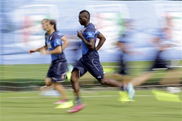Italy's player Mario Balotelli sprints during his team's training session in Mangaratiba, Brazil, Wednesday, June 18, 2014. Balotelli marked his first World Cup game by scoring the winner for Italy against England. (AP Photo/Antonio Calanni) Italy's player Mario Balotelli sprints during his team's training session in Mangaratiba, Brazil, Wednesday, June 18, 2014. Balotelli marked his first World Cup game by scoring the winner for Italy against England. (AP Photo/Antonio Calanni)