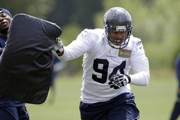 Seattle Seahawks' Kevin Williams runs through a drill at an NFL football minicamp practice Wednesday, June 18, 2014, in Renton, Wash. (AP Photo/Elaine Thompson)