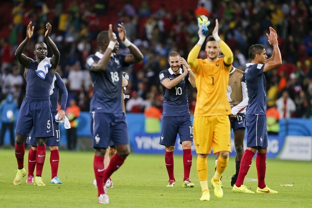 France's Karim Benzema (10)celebrates with teammates at the end of the group E World Cup soccer match between France and Honduras at the Estadio Beira-Rio in Porto Alegre, Brazil, Sunday, June 15, 2014. France won the match 3-0. (AP Photo/Jon Super)