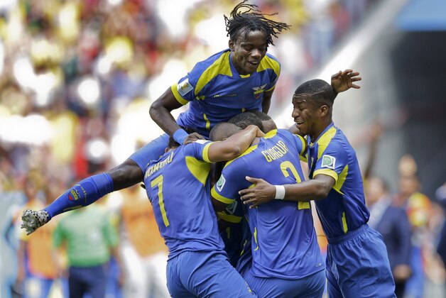 Ecaudor players celebrate after Enner Valencia scored the opening goal during the group E World Cup soccer match between Switzerland and Ecuador at the Estadio Nacional in Brasilia, Brazil, Sunday, June 15, 2014. (AP Photo/Michael Sohn)