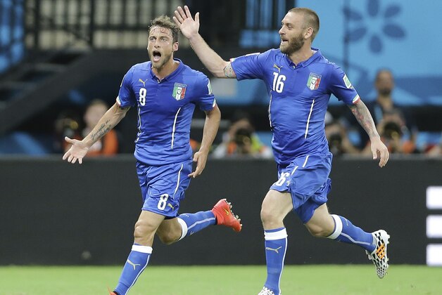 Italy's Claudio Marchisio, left, celebrates with his teammate Italy's Daniele De Rossi after scoring during the group D World Cup soccer match between England and Italy at the Arena da Amazonia in Manaus, Brazil, Saturday, June 14, 2014. (AP Photo/Antonio Calanni) Italy's Claudio Marchisio, left, celebrates with his teammate Italy's Daniele De Rossi after scoring during the group D World Cup soccer match between England and Italy at the Arena da Amazonia in Manaus, Brazil, Saturday, June 14, 2014. (AP Photo/Antonio Calanni)