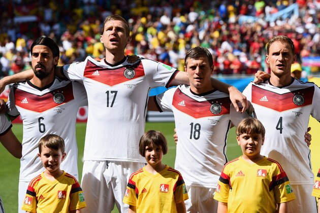 SALVADOR, BRAZIL - JUNE 16:  Sami Khedira, Per Mertesacker, Toni Kroos and Benedikt Hoewedes of Germany look on before the 2014 FIFA World Cup Brazil Group G match between Germany and Portugal at Arena Fonte Nova on June 16, 2014 in Salvador, Brazil.  (Photo by Stu Forster/Getty Images)