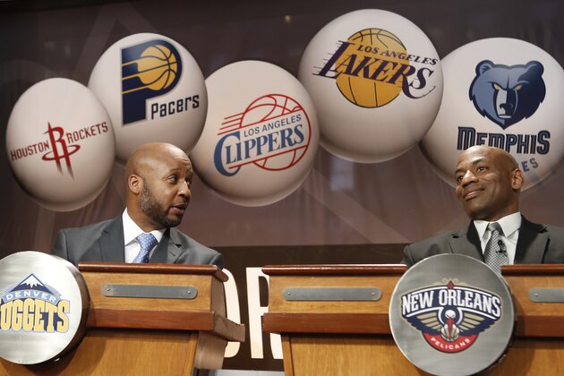 Denver Nuggetscoach Brian Shaw, left, chats with New Orleans Pelicans general manager Dell Demps before the NBA basketball draft lottery in New York, Tuesday, May 20, 2014.  (AP Photo/Kathy Willens)