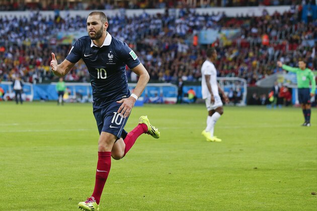 France's Karim Benzema celebrates after scoring his side's third goal during the group E World Cup soccer match between France and Honduras at the Estadio Beira-Rio in Porto Alegre, Brazil, Sunday, June 15, 2014.  (AP Photo/Jon Super)