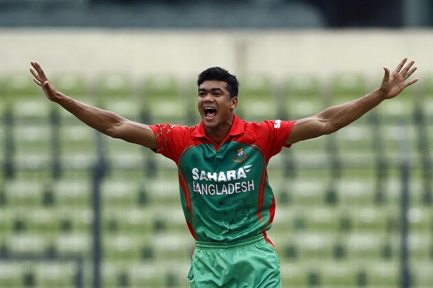 Bangladesh's Taskin Ahmed unsuccessfully makes an LBW appeal during their third one-day International cricket match against India in Dhaka, Bangladesh, Thursday, June 19, 2014. (AP Photo/A.M. Ahad)