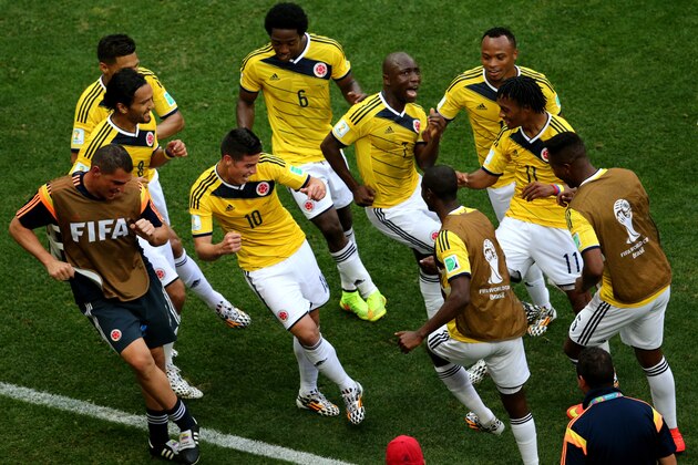 BRASILIA, BRAZIL - JUNE 19: James Rodriguez #10 of Colombia celebrates by dancing with teammates after scoring his team's first goal during the 2014 FIFA World Cup Brazil Group C match between Colombia and Cote D'Ivoire at Estadio Nacional on June 19, 2014 in Brasilia, Brazil.  (Photo by Adam Pretty/Getty Images)