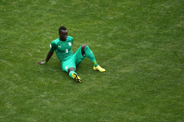 BRASILIA, BRAZIL - JUNE 19:  Arthur Boka of the Ivory Coast looks dejected after a 2-1 defeat in the 2014 FIFA World Cup Brazil Group C match between Colombia and Cote D'Ivoire at Estadio Nacional on June 19, 2014 in Brasilia, Brazil.  (Photo by Adam Pretty/Getty Images)