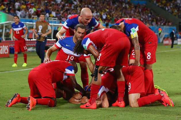 NATAL, BRAZIL - JUNE 16: John Brooks of the United States celebrates scoring his team's second goal with teammates during the 2014 FIFA World Cup Brazil Group G match between Ghana and the United States at Estadio das Dunas on June 16, 2014 in Natal, Brazil.  (Photo by Kevin C. Cox/Getty Images)
