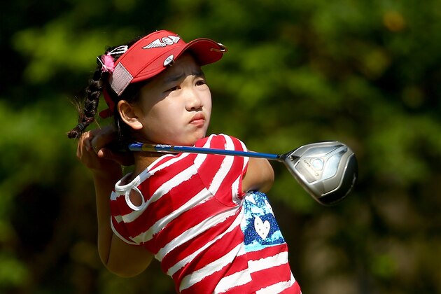 PINEHURST, NC - JUNE 19:  Eleven-year old Amateur Lucy Li of the United States watches a tee shot on the third hole during the first round of the 69th U.S. Women's Open at Pinehurst Resort & Country Club, Course No. 2  on June 19, 2014 in Pinehurst, North Carolina.  (Photo by Streeter Lecka/Getty Images)