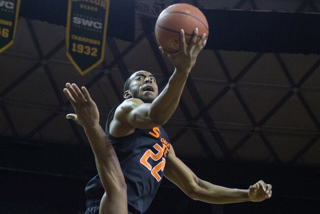 Feb 17, 2014; Waco, TX, USA; Oklahoma State Cowboys guard Markel Brown (22) shoots the ball over Baylor Bears forward Rico Gathers (2) during the first half at the Ferrell Center. Mandatory Credit: Jerome Miron-USA TODAY Sports
