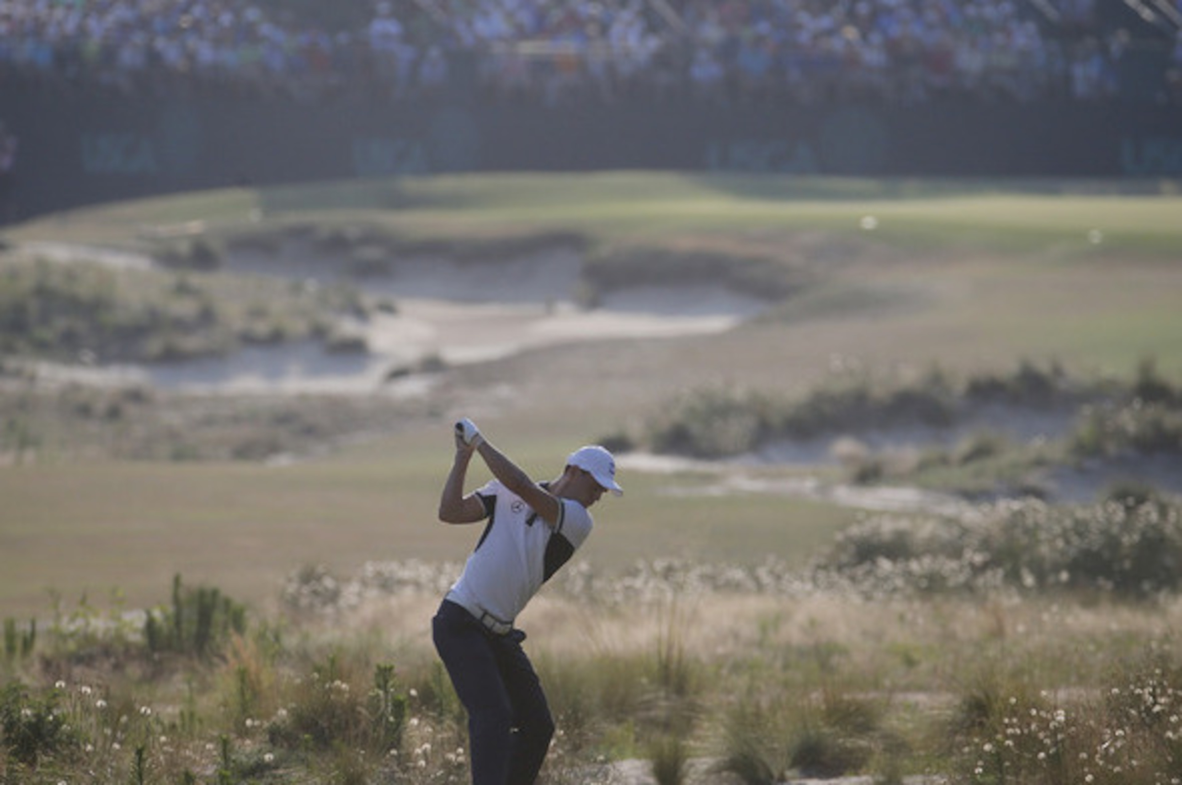 Martin Kaymer, of Germany hits his tee shot on the 13th hole during the final round of the U.S. Open golf tournament in Pinehurst, N.C., Sunday, June 15, 2014. (AP Photo/Matt York)
