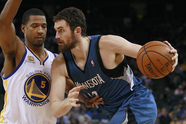 Minnesota Timberwolves power forward Kevin Love (42) dribbles against Golden State Warriors small forward Dominic McGuire (5) during an NBA basketball game in Oakland, Calif., Monday, March 19, 2012. (AP Photo/Jeff Chiu)