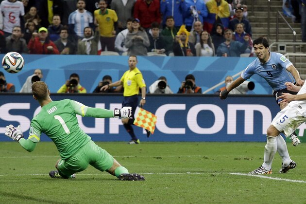 Uruguay's Luis Suarez scores his side's second goal during the group D World Cup soccer match between Uruguay and England at the Itaquerao Stadium in Sao Paulo, Brazil, Thursday, June 19, 2014.  (AP Photo/Matt Dunham)