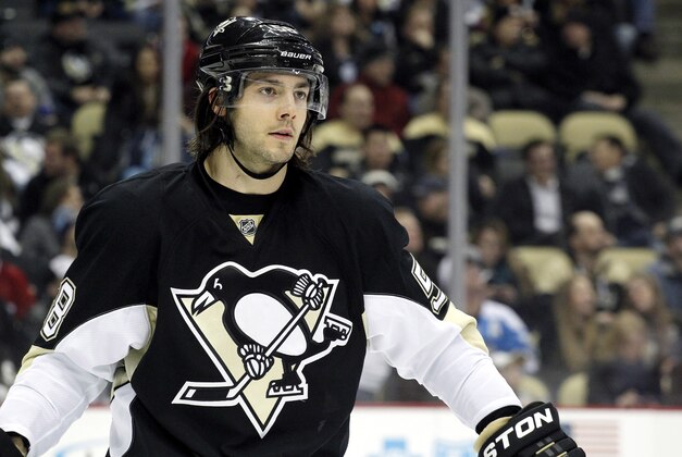 Jan 22, 2014; Pittsburgh, PA, USA; Pittsburgh Penguins defenseman Kris Letang (58) at the face-off circle against the Montreal Canadiens during the third period at the CONSOL Energy Center. The Penguins won 5-1. Mandatory Credit: Charles LeClaire-USA TODAY Sports