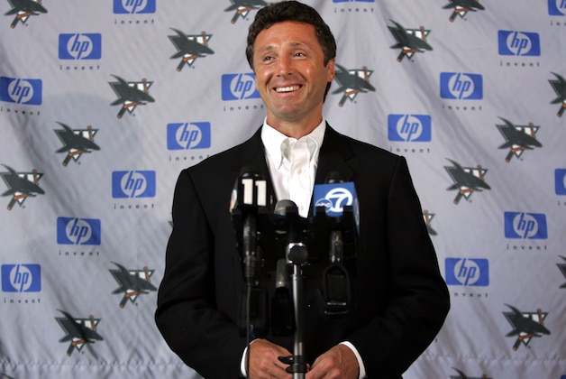 San Jose Sharks General Manager Doug Wilson smiles during a news conference in San Jose, Calif., Wednesday, July 13, 2005, as he talks about the possible end of the NHL lockout. After losing an entire season to a lockout, players and owners ended an all-night bargaining session Wednesday by reaching their goal: a tentative deal, expected to include a salary cap, that virtually ensures hockey will return this fall. (AP Photo/Paul Sakuma)