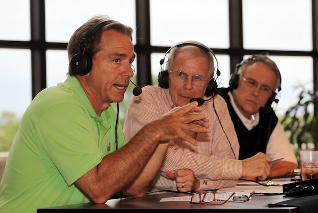 This photo released by the University  of Alabama  shows head football coach Nick Saban,left,and  broadcasters Tom Roberts center, and Tom Stipe,right, are shown during the