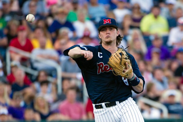 Jun 19, 2014; Omaha, NE, USA; Mississippi Rebels infielder Austin Anderson (8) makes the throw to first base against the TCU Horned Frogs during game ten of the 2014 College World Series at TD Ameritrade Park Omaha. Mandatory Credit: Steven Branscombe-USA TODAY Sports