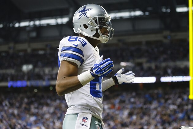 Dallas Cowboys wide receiver Terrance Williams (83) reacts after he scores a touchdown against the Detroit Lions during an NFL football game in Detroit, Sunday, Oct. 27, 2013. (AP Photo/Rick Osentoski)