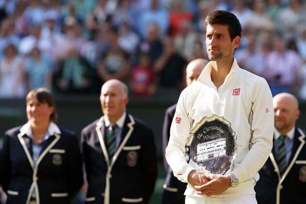 LONDON, ENGLAND - JULY 07:  Andy Murray of Great Britain holds the runner-up trophy following his defeat in the Gentlemen's Singles Final match against Andy Murray of Great Britain on day thirteen of the Wimbledon Lawn Tennis Championships at the All England Lawn Tennis and Croquet Club on July 7, 2013 in London, England.  (Photo by Clive Brunskill/Getty Images)