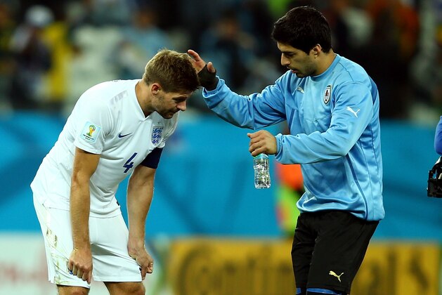 SAO PAULO, BRAZIL - JUNE 19:  Luis Suarez of Uruguay consoles Steven Gerrard of England after Uruguay's 2-1 victory in the 2014 FIFA World Cup Brazil Group D match between Uruguay and England at Arena de Sao Paulo on June 19, 2014 in Sao Paulo, Brazil.  (Photo by Clive Rose/Getty Images)