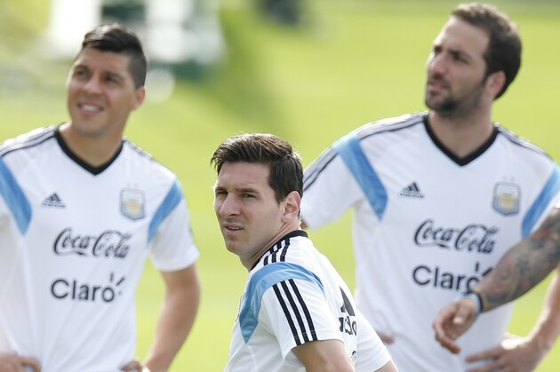 Argentina's Lionel Messi, center, stands with teammates Enzo Perez, left, and Gonzalo Higuain, right, during a training session in Vespasiano, near Belo Horizonte, Brazil, Wednesday, June 18, 2014. Argentina plays in group F of the 2014 soccer World Cup. (AP Photo/Victor R. Caivano) Argentina's Lionel Messi, center, stands with teammates Enzo Perez, left, and Gonzalo Higuain, right, during a training session in Vespasiano, near Belo Horizonte, Brazil, Wednesday, June 18, 2014. Argentina plays in group F of the 2014 soccer World Cup. (AP Photo/Victor R. Caivano)